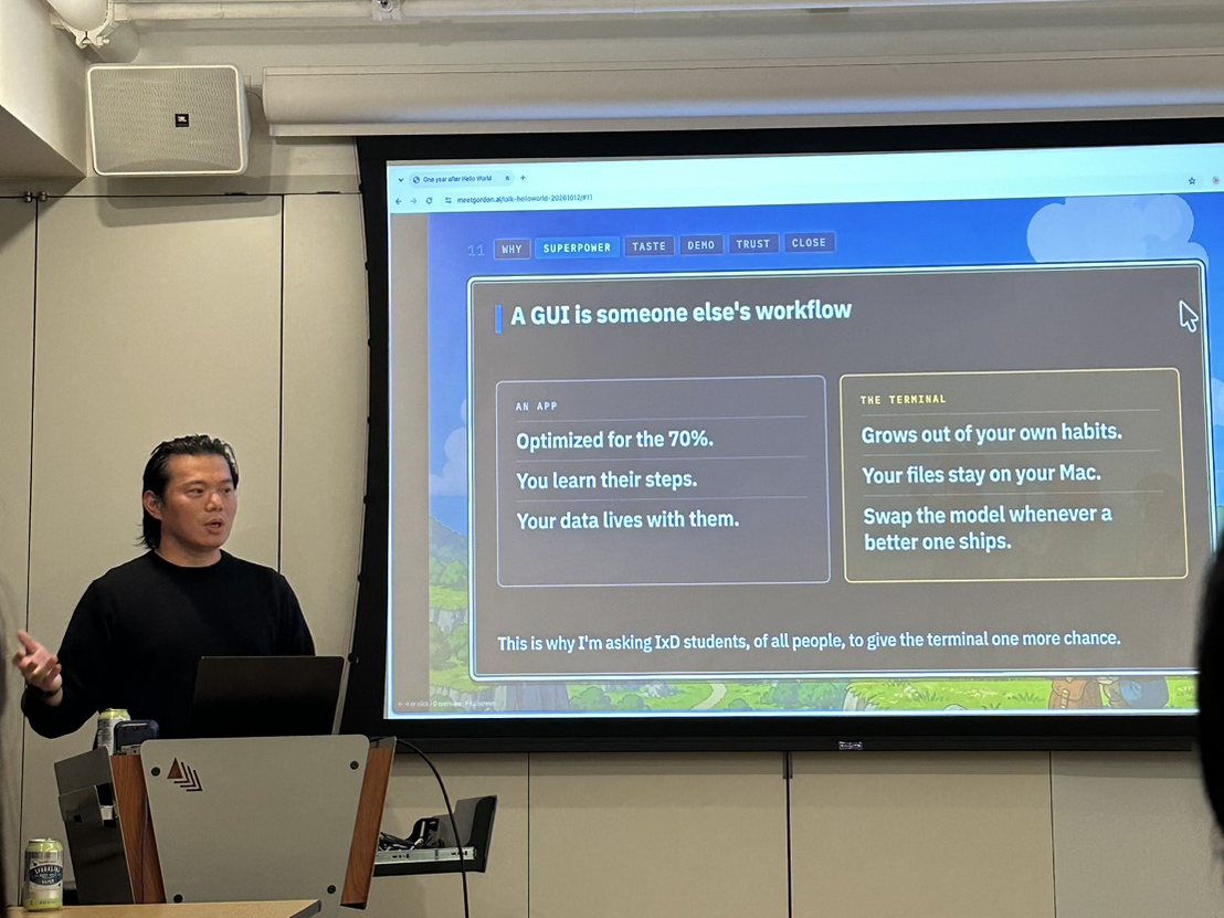 Gordon presenting a slide comparing an app with the terminal