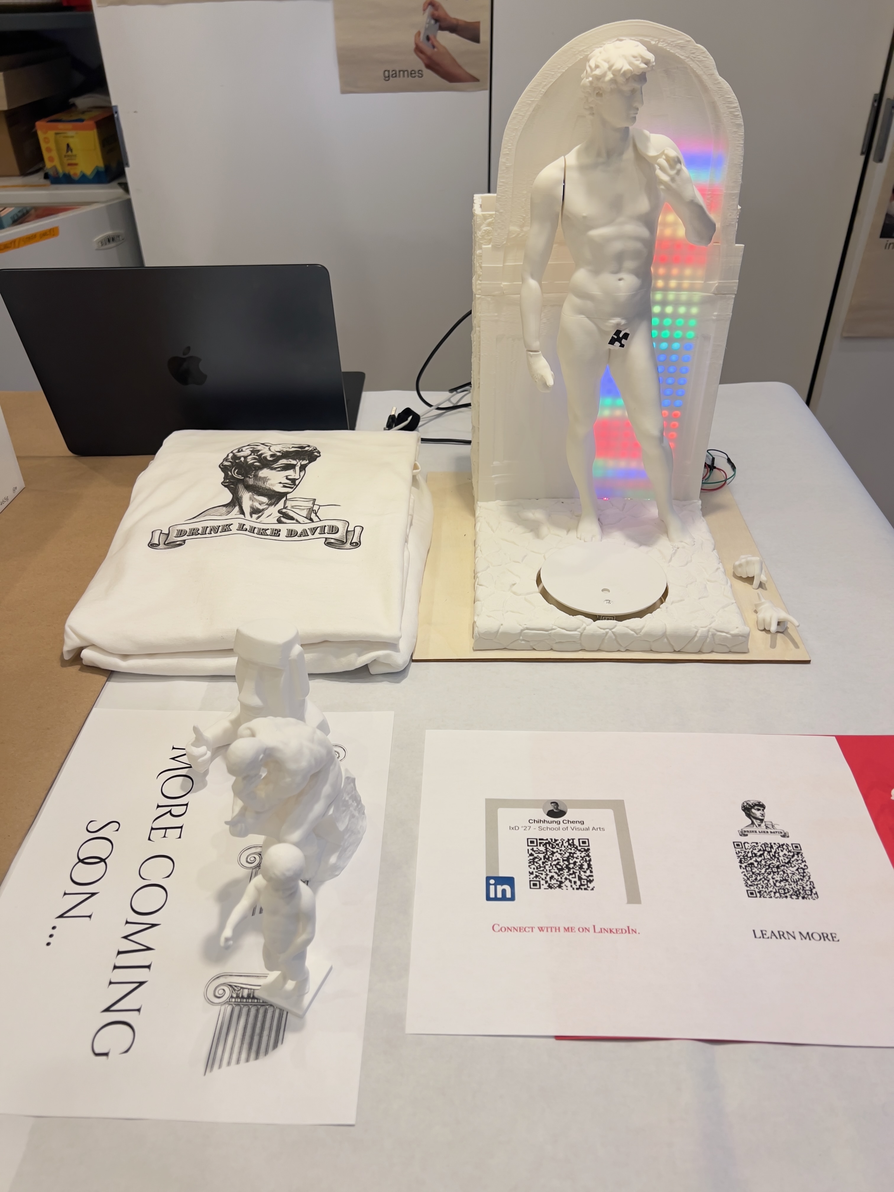 Drink Like David — finished product with rainbow LED, T-shirt merch, and mini David figurines